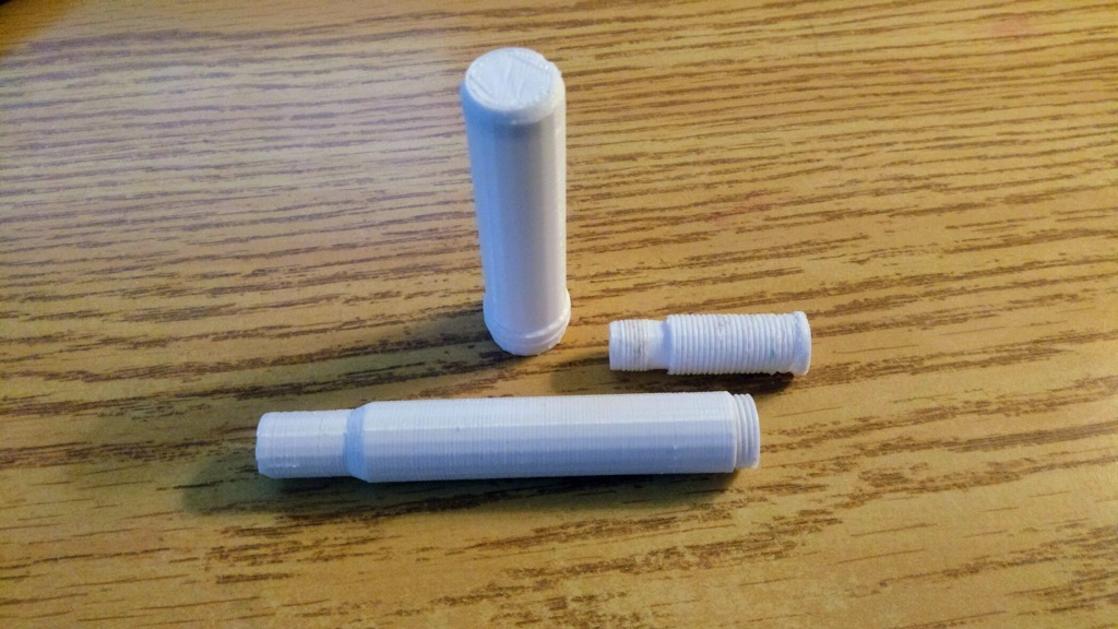 Photo of the three parts of the 3D printed pen.