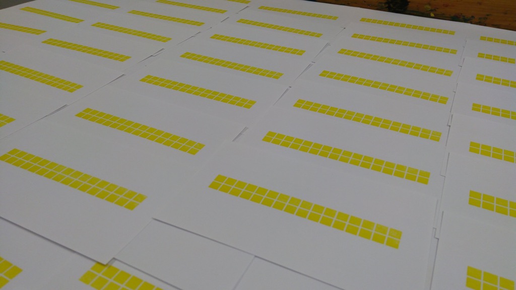 Photo of many yellow-printed index cards