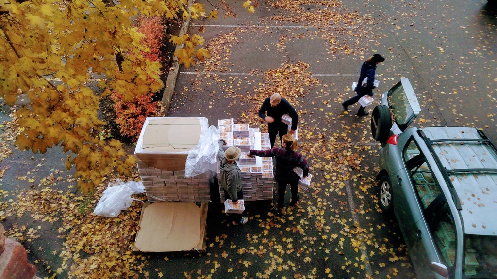 A photo of two palettes of The Buzz being unloaded.