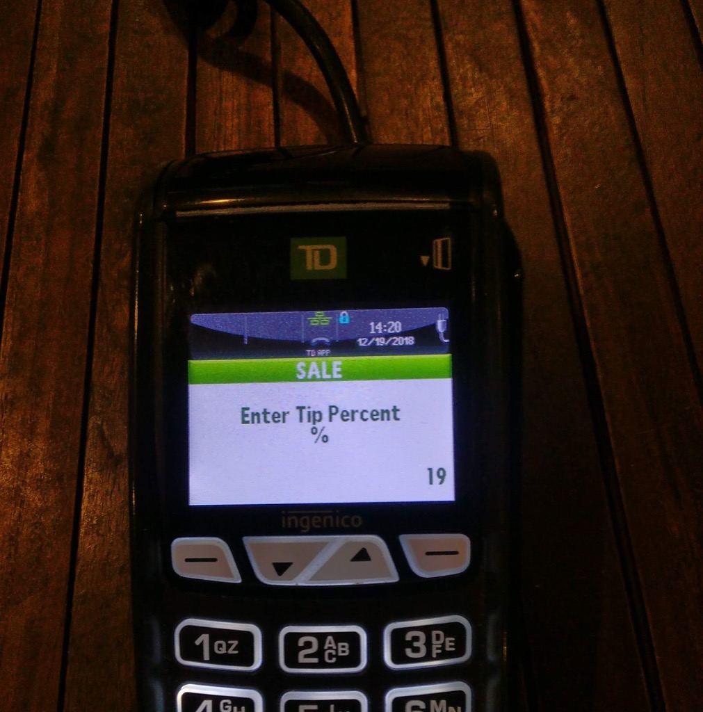 Photo of a debit machine at Mr. Sushi showing an 19% tip.