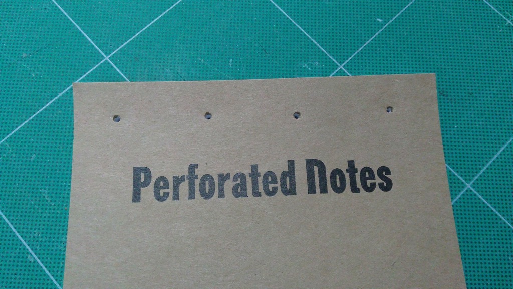 Photo of punched notebook front.