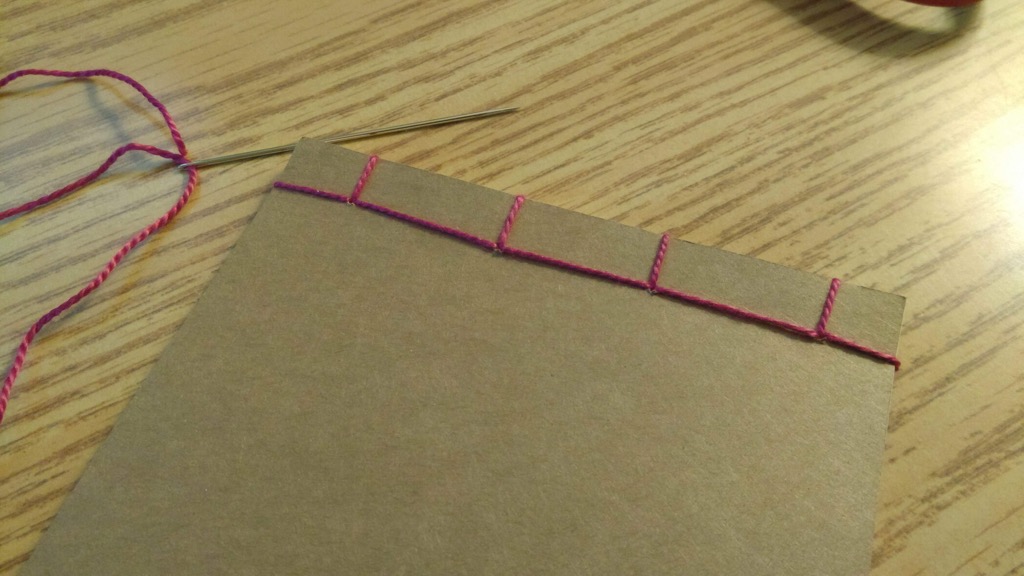 Photo of bound notebook from the back.