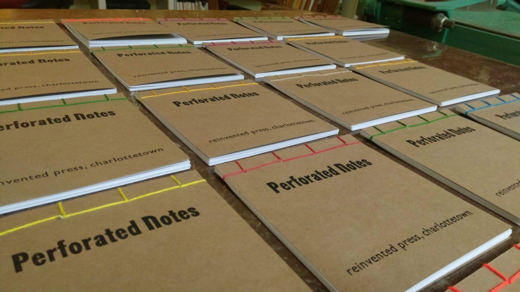 Photo of 23 bound notebooks.