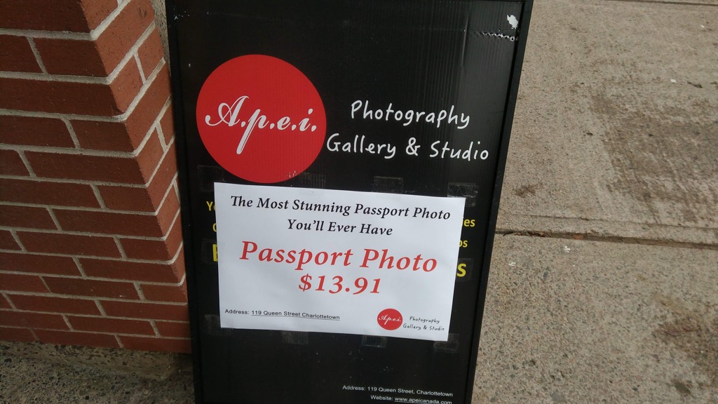 Sandwich Board for A.P.E.I. Passport Photos