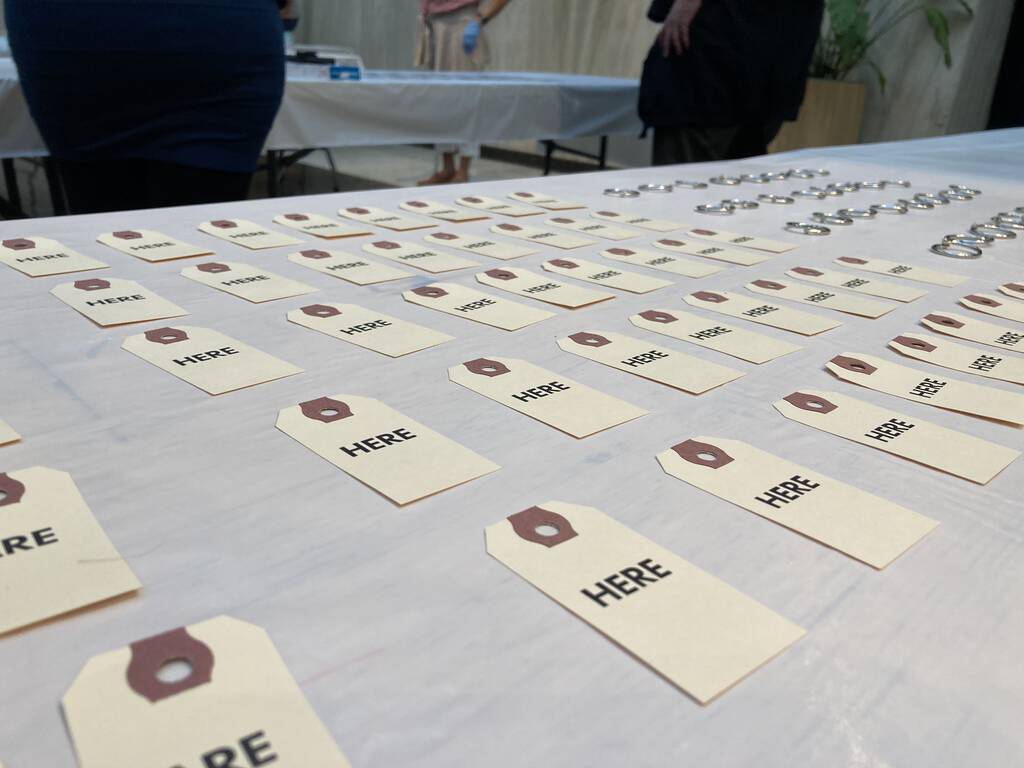 My table at Artist Trading Card night 2020 at Confederation Centre of the Arts, with my We Are Here laid out.