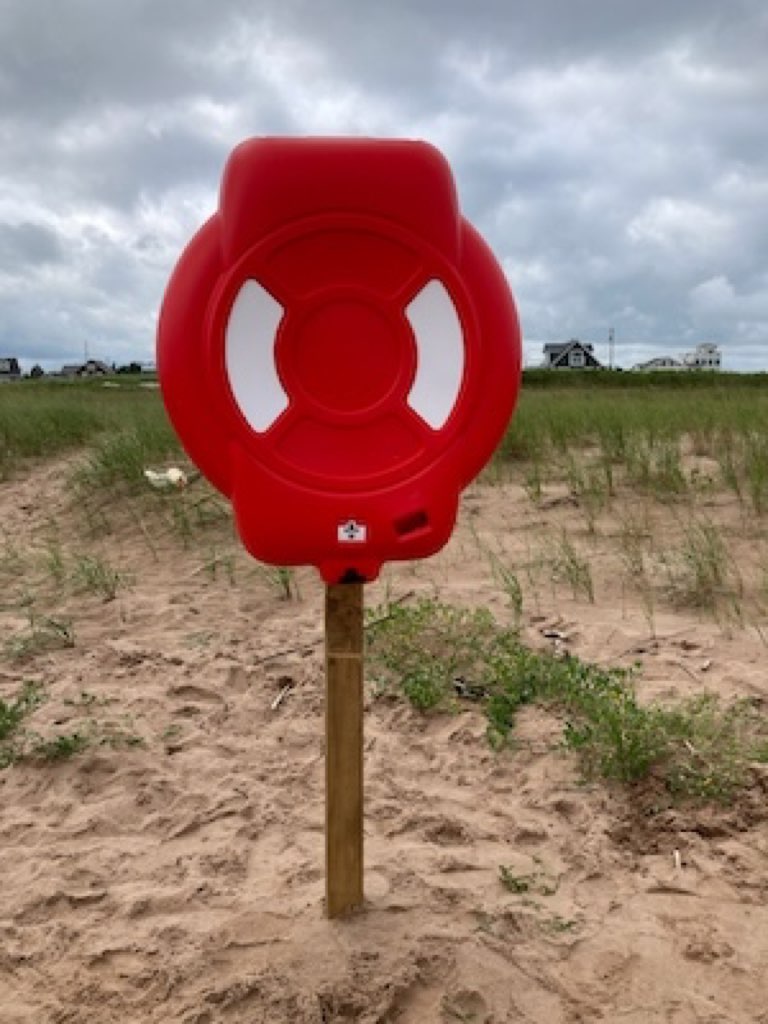 Life buoy in place on the beach.