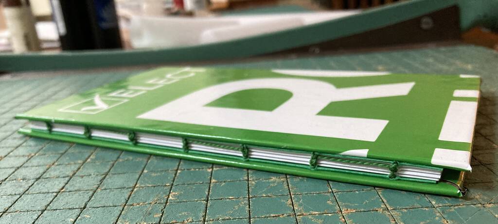 Handbound book with Green Party lawn sign as cover