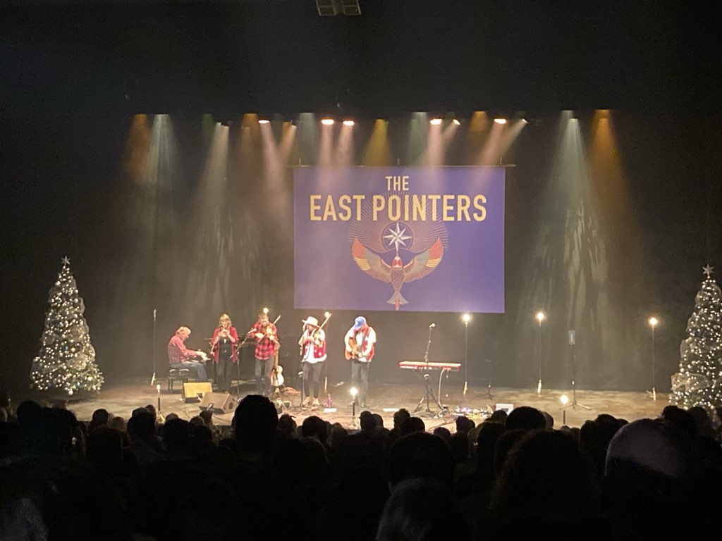 Photo from the audience of The East Pointers on stage at the Confederation Centre of the Arts, December 16, 2023.