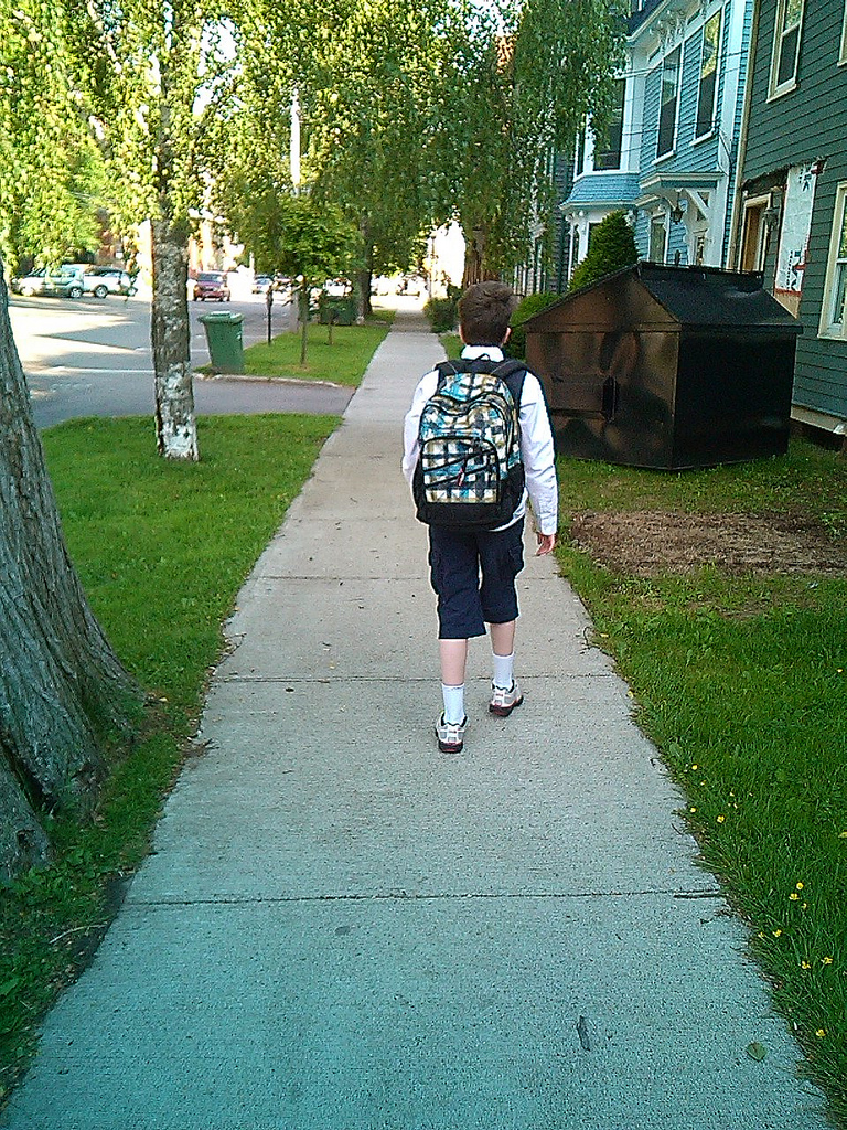Olivia walking up Prince Street on the last day of grade six