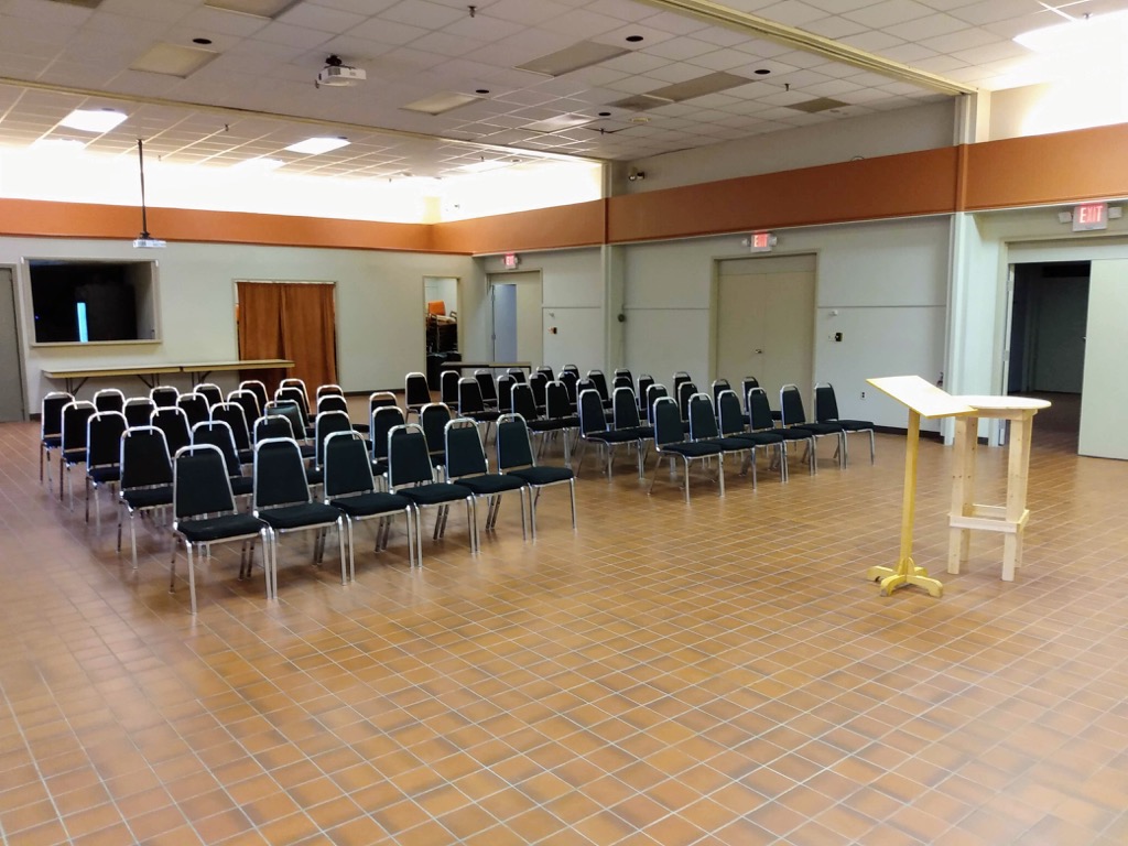 The Farm Centre meeting room with Green Party chairs set up.