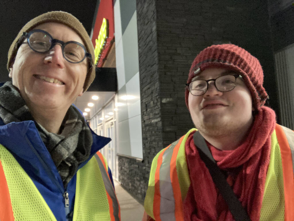 Me and Oliver wearing high vis vests.