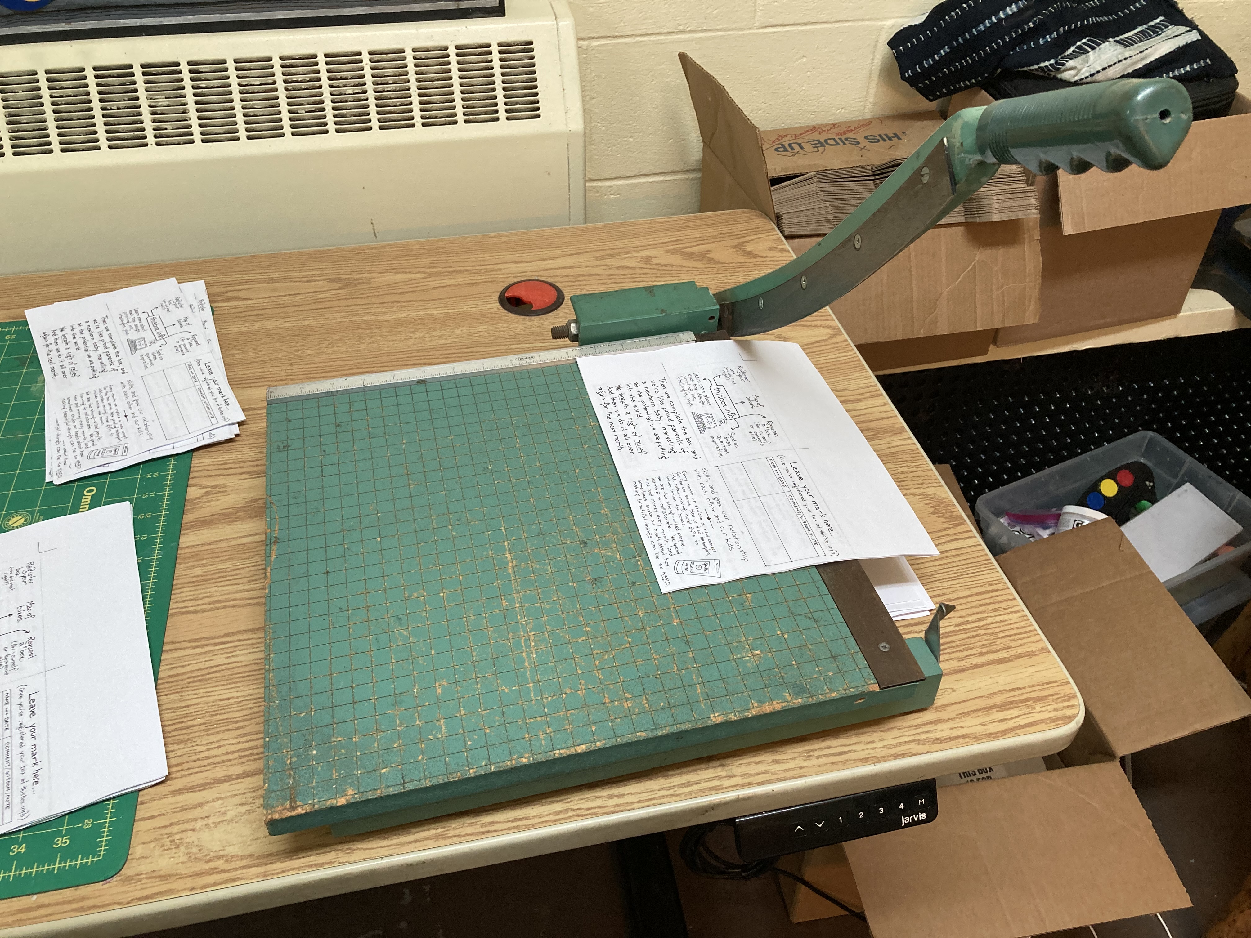 The paper cutter in our studio, blade extended, ready to cut.