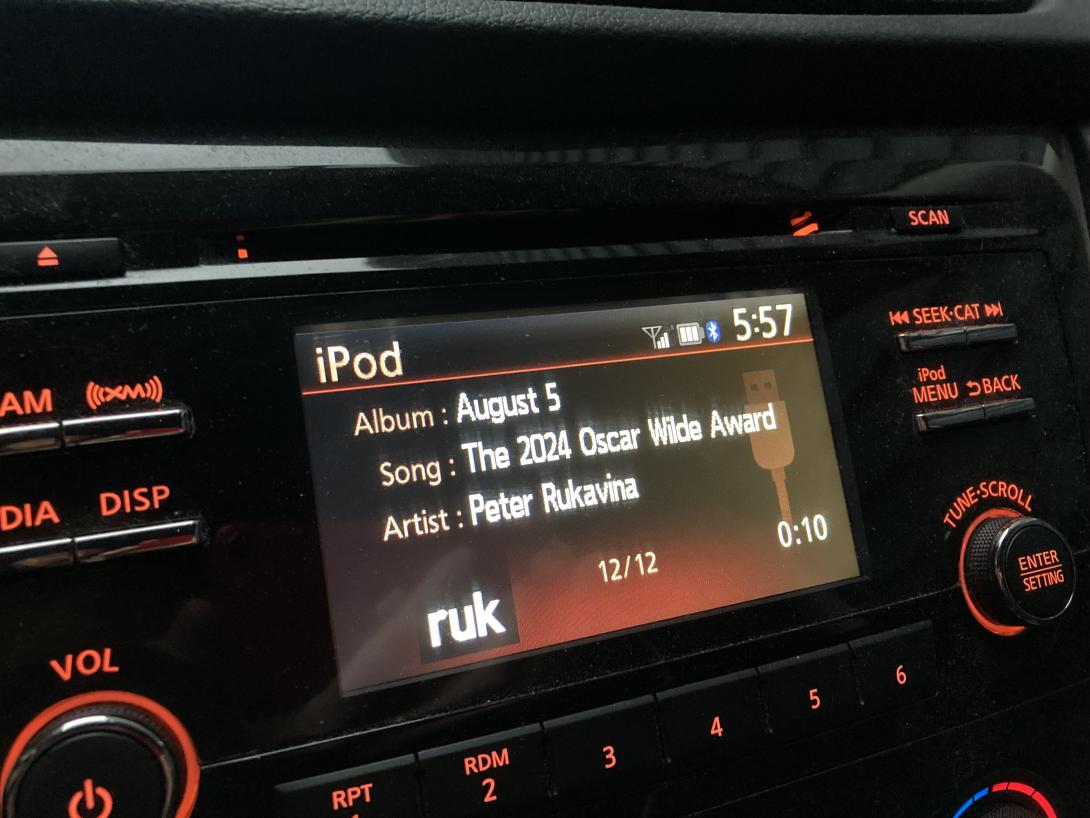 My ruk.ca podcast playing in a Nissan Rogue, with the episode details showing on the dash screen. 