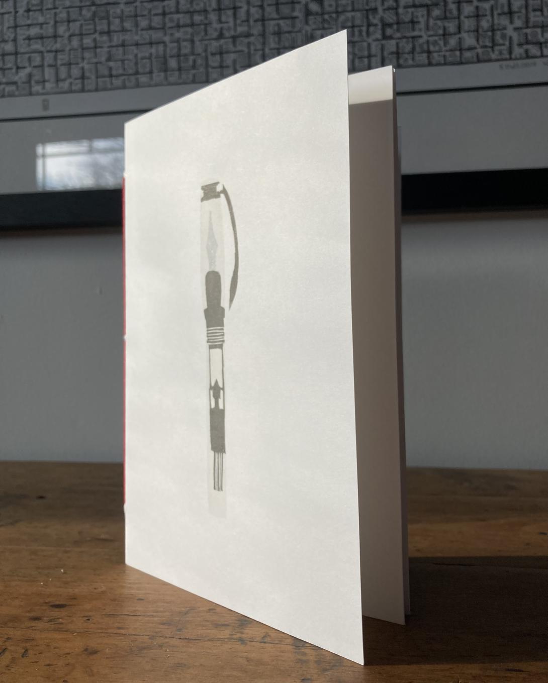 A notebook with the print on the cover.