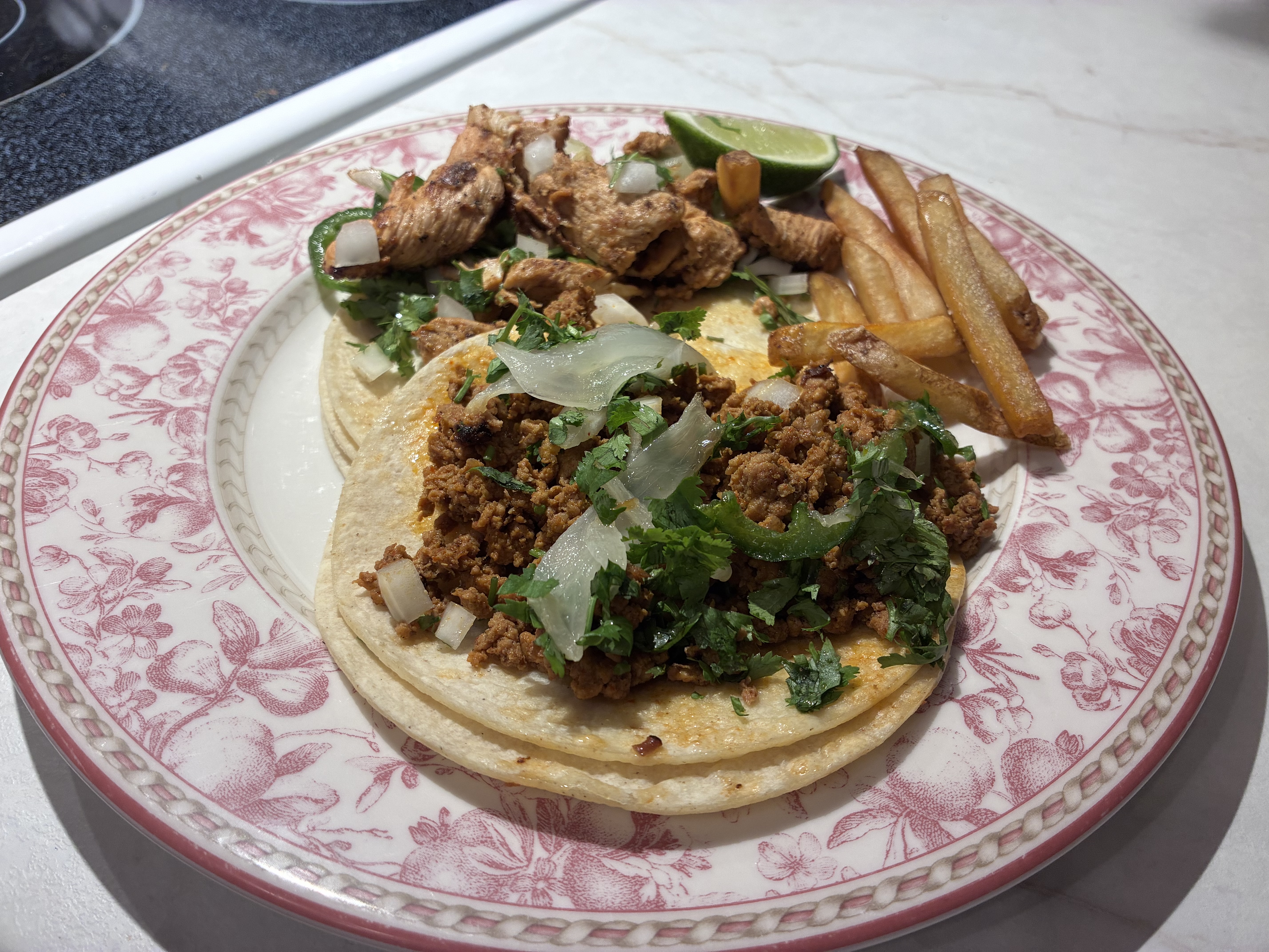 Two tacos on a plate.