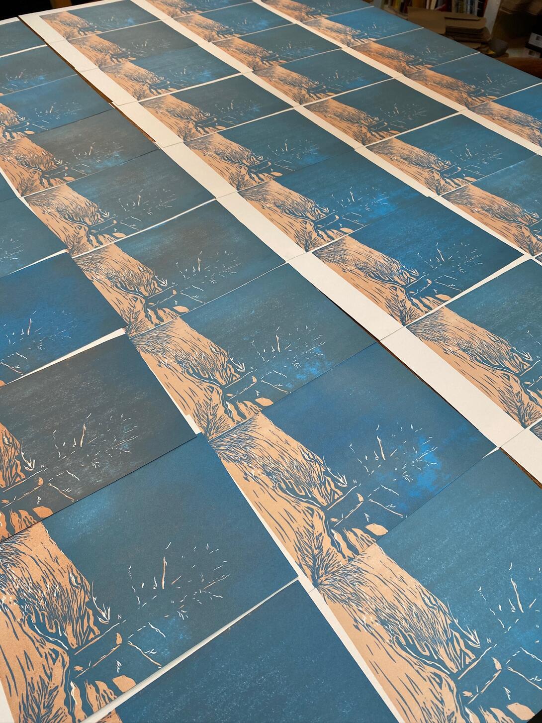 Prints in copper and block laid to dry.