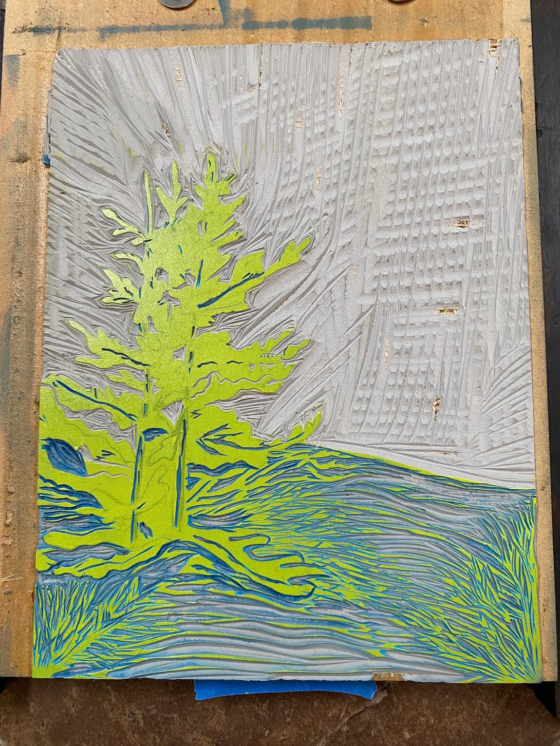 Lino block with yellow ink.