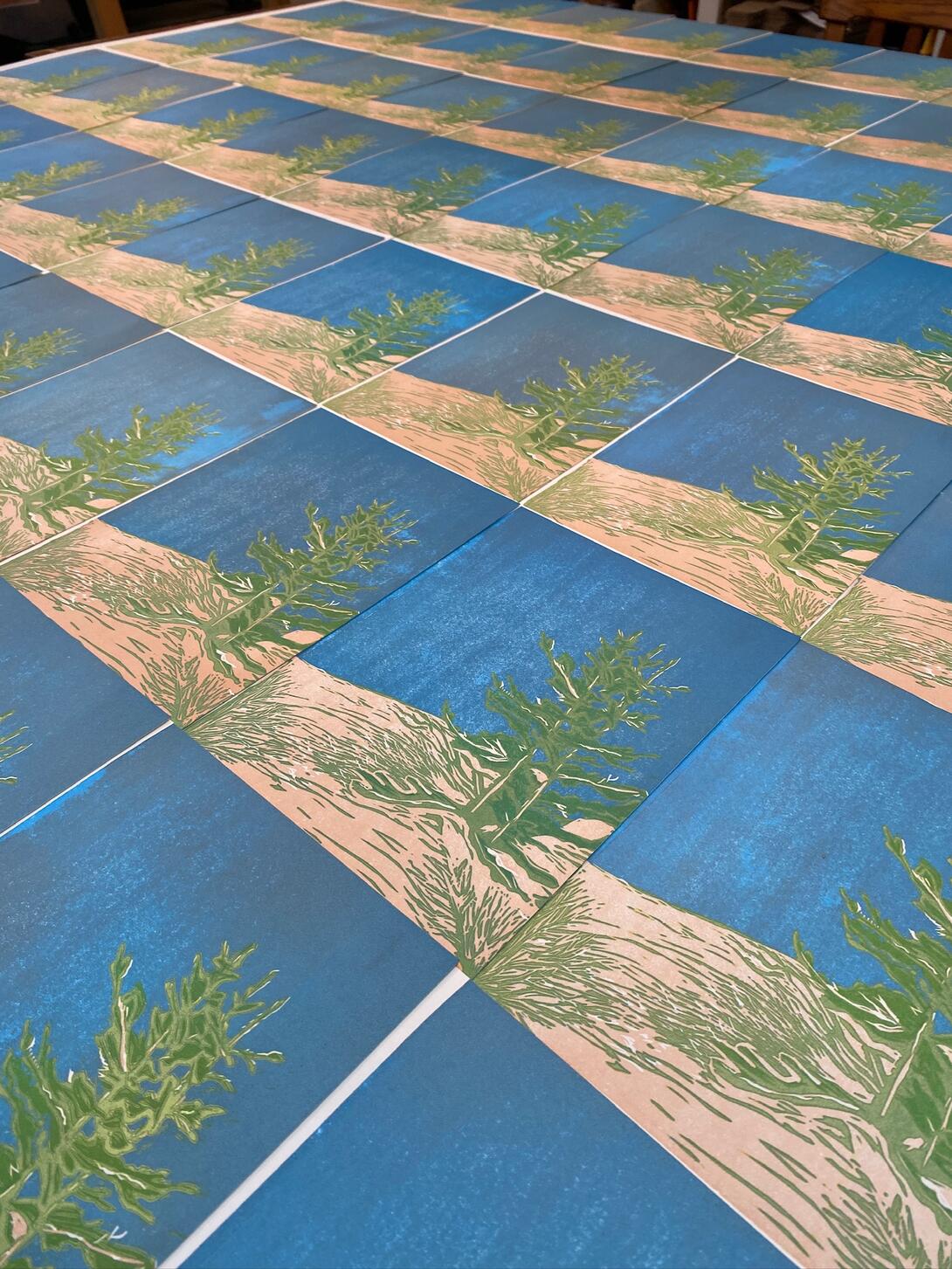 Prints with copper, blue, yellow printed, laid to dry.