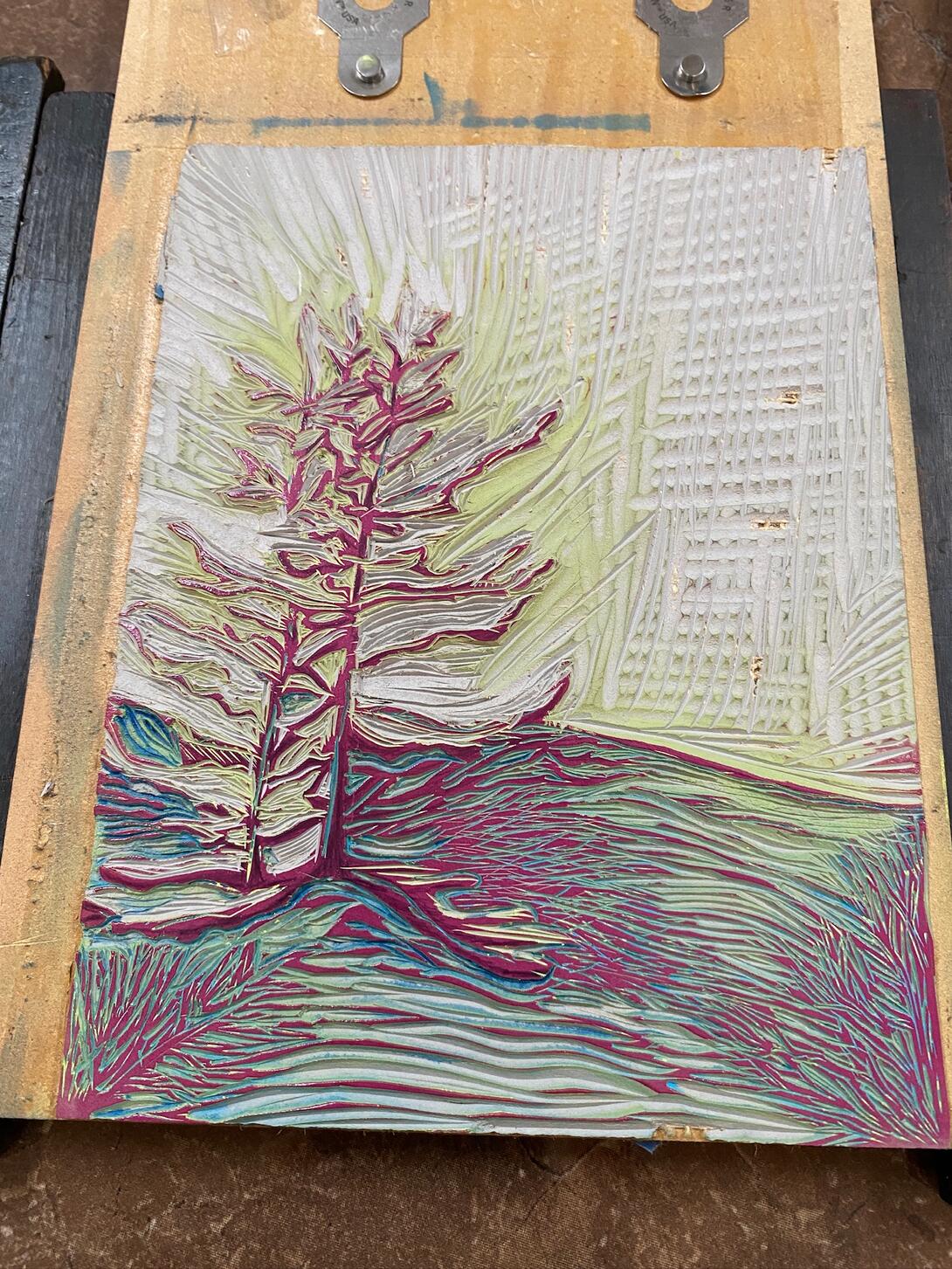Lino block with magenta.