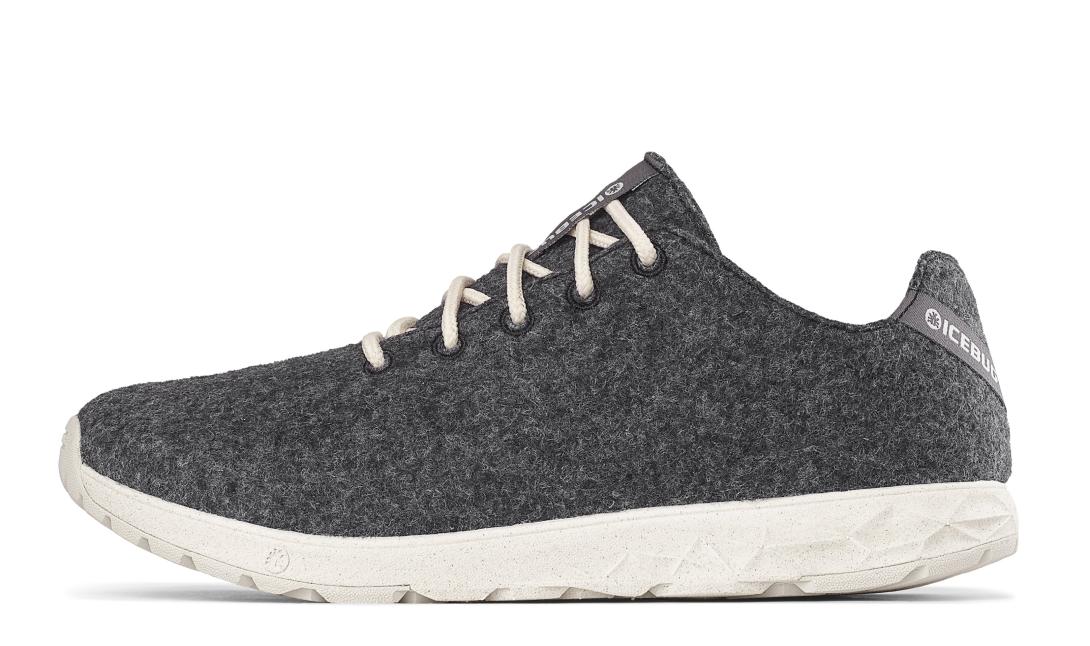 A single grey-coloured shoe, with white shoelaces, pictured from the side. The material looks mottled, and there is a branding on the tongue and heel, "Icebug".