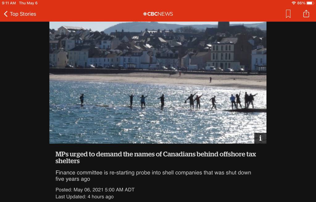 Screen shot from CBC News website showing photo of people appearing to walk on the water on the Isle of Man just offshore