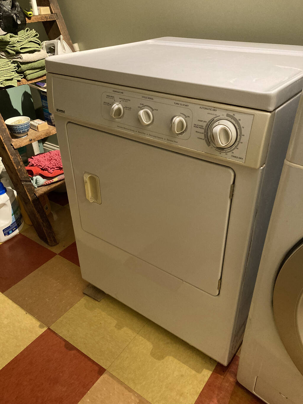 Our old Kenmore clothes dryer, in its space in our laundry room.