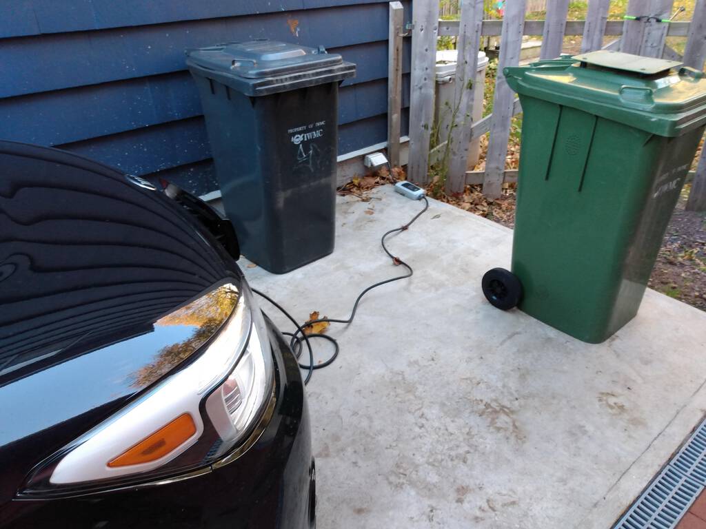 The Kia Soul EV charging from a regular outlet at our house.