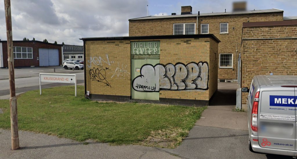 The same Malmö Elverk sign in context, on a beige-brick building in an industrial area, in Google Maps Street View