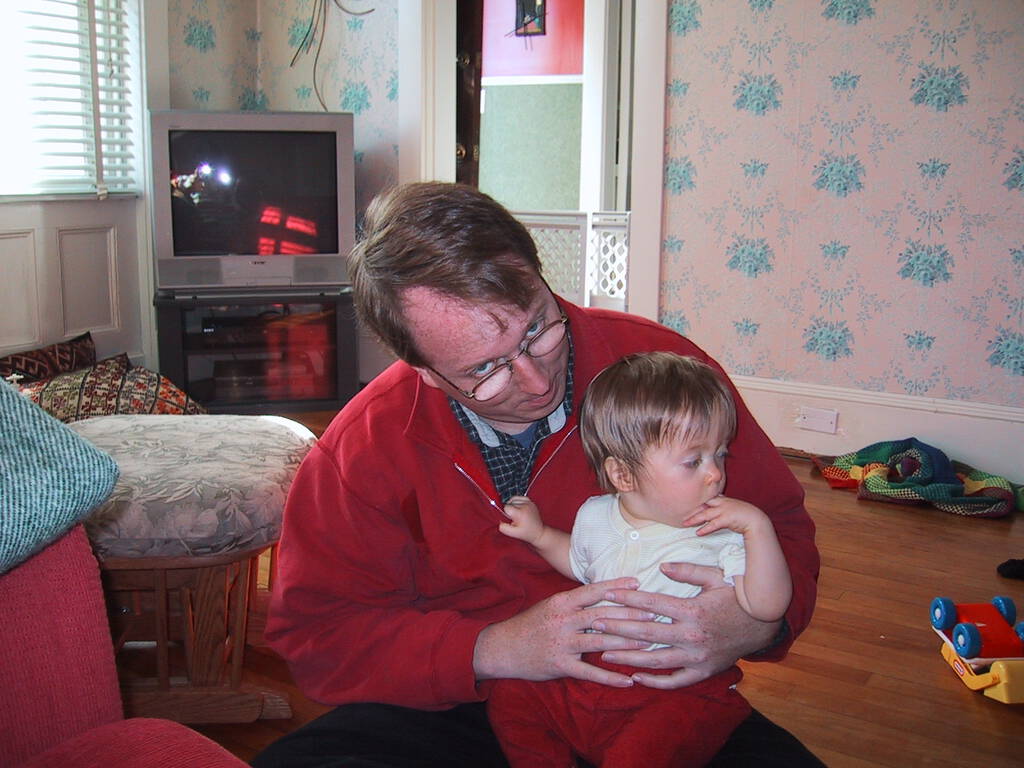 Photo of me and Oliver in front of the television in 2001.