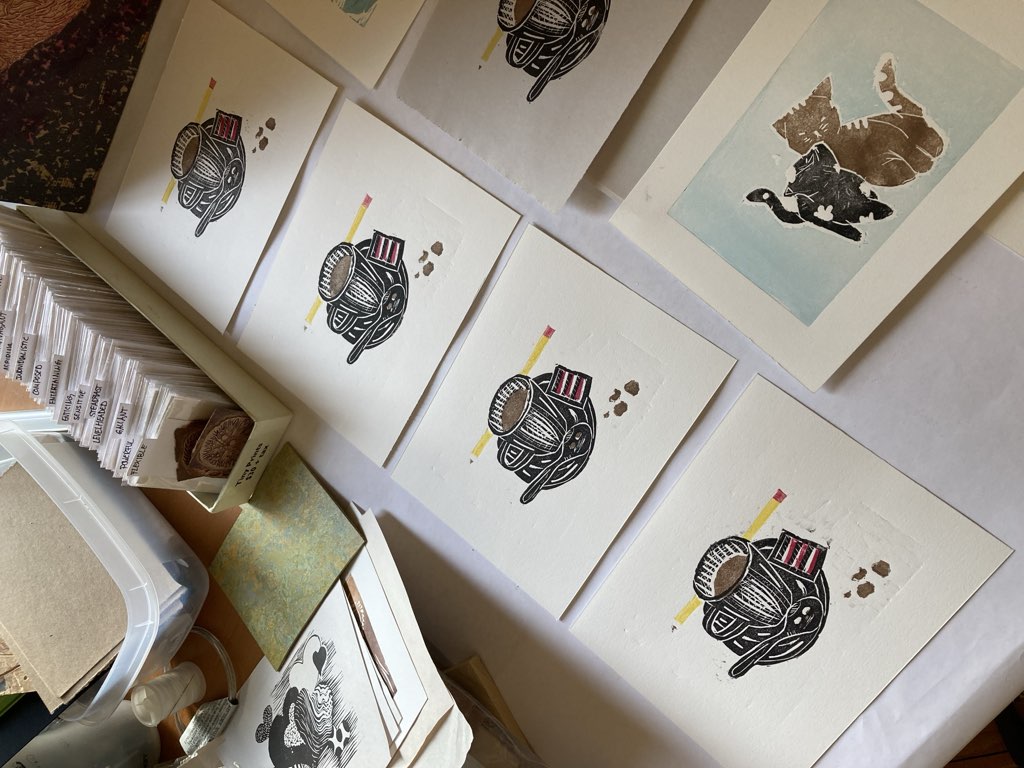 Four copies of the final coffee cup print, set to dry.
