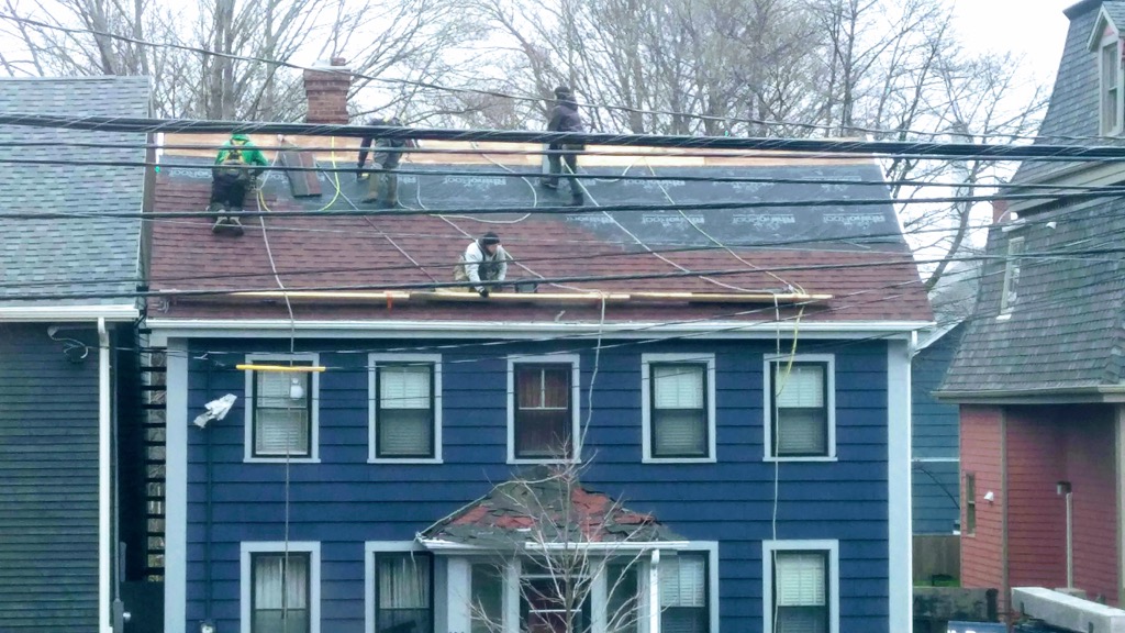 Photo of MacBeth Bros. putting on our new roof in November 2018