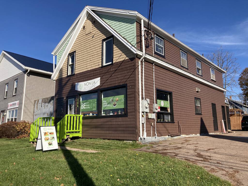 Photo of Non La Vegetarian Cafe on University Avenue in Charlottetown, housed in an older home freshly paint brown.