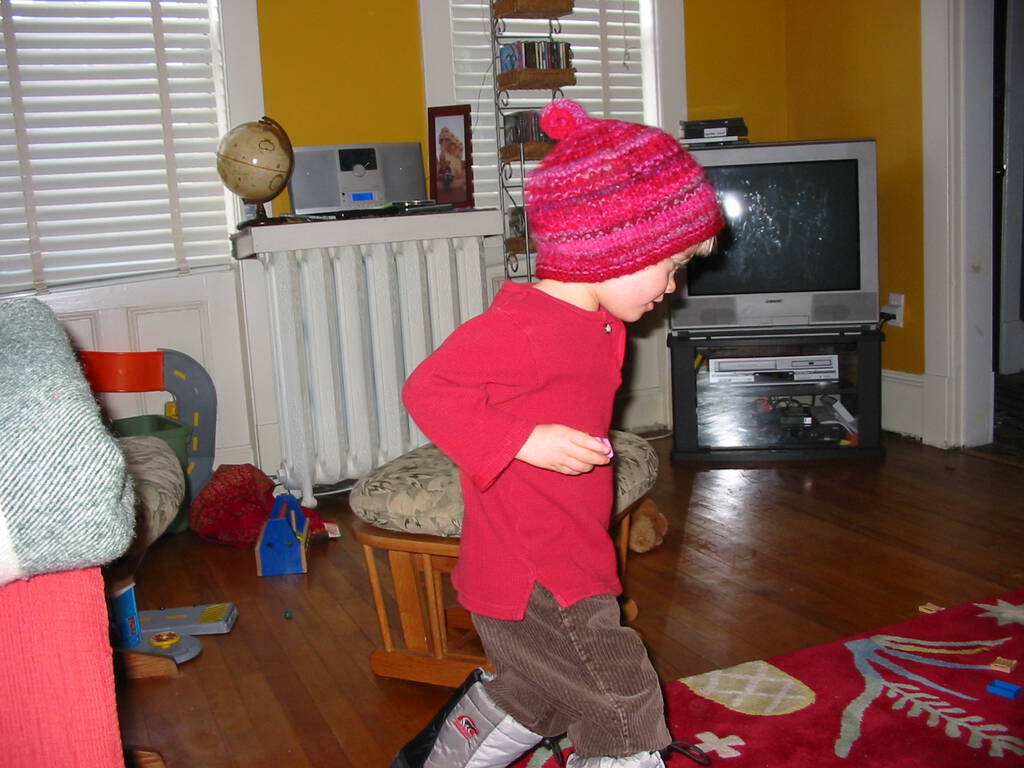 Oliver in front of the TV in winter boots in 2004