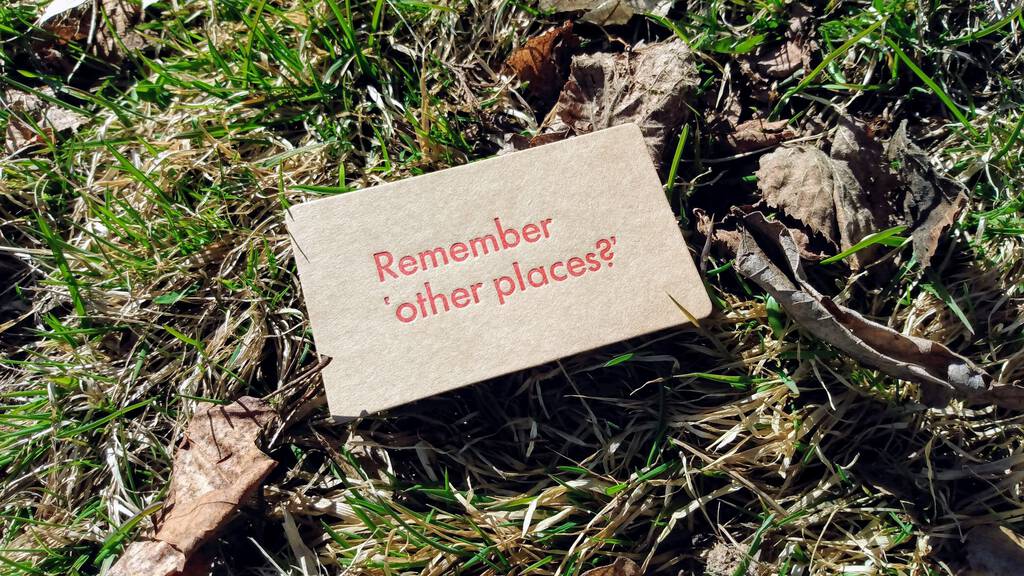Remember 'other places?' printed in red on a brown card.