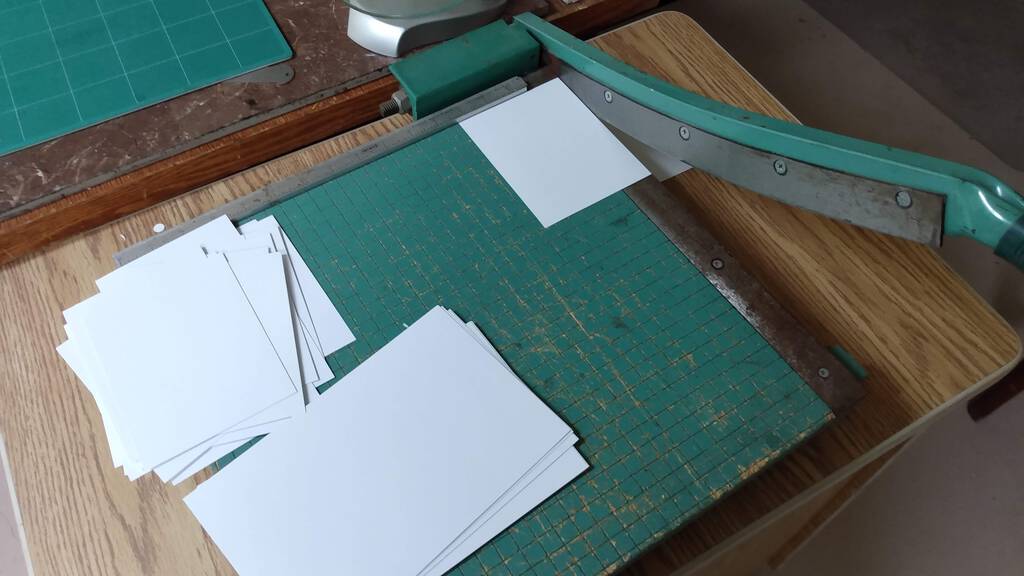 Slicing up paper on the paper cutter.