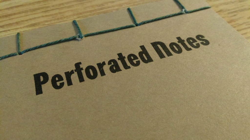 Photo of detail of stab binding of Perforated Notes book.