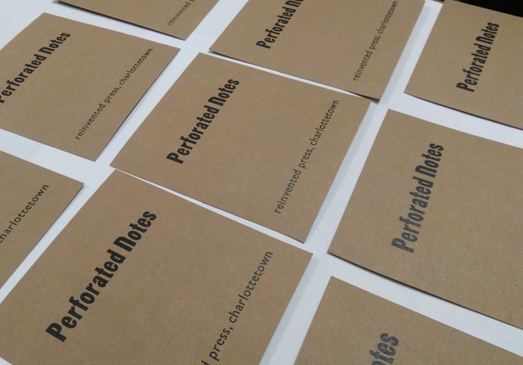 Photo of Perforated Notes covers freshly printed and waiting to dry