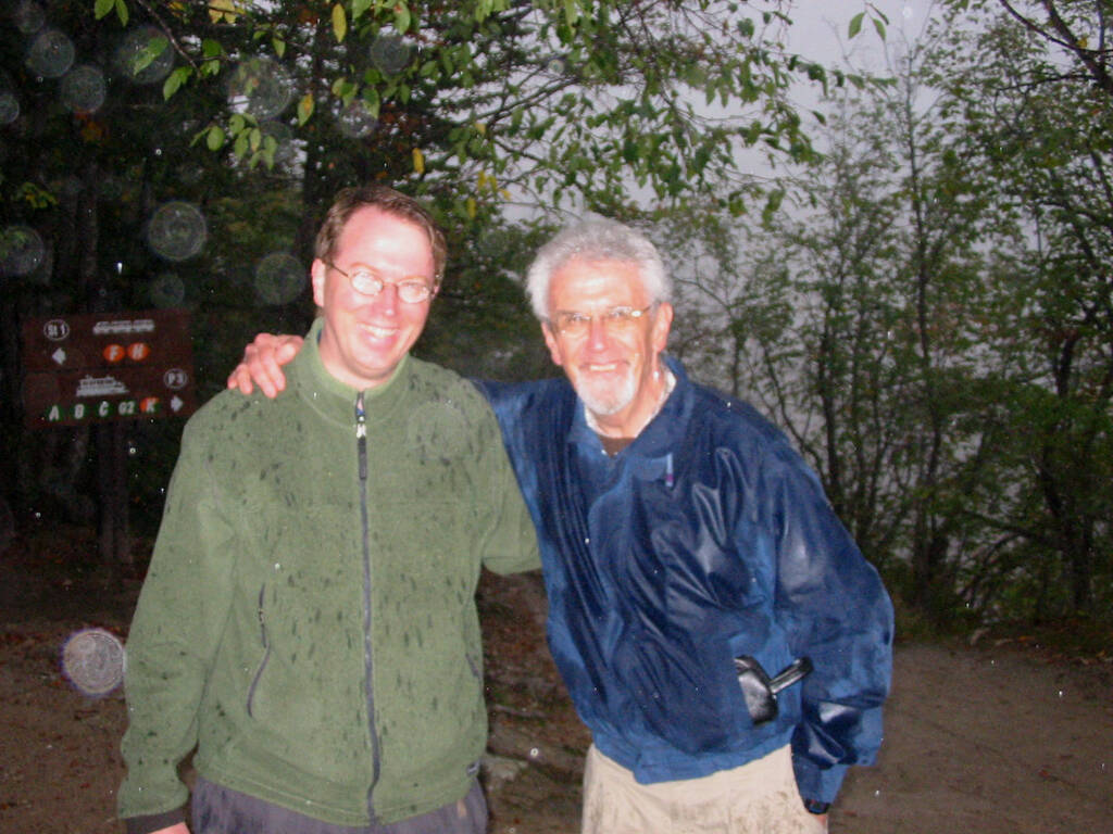 Me on the left, my father on the right, soaked from the rain, in a forest in Croatia, with our glasses fogged up.