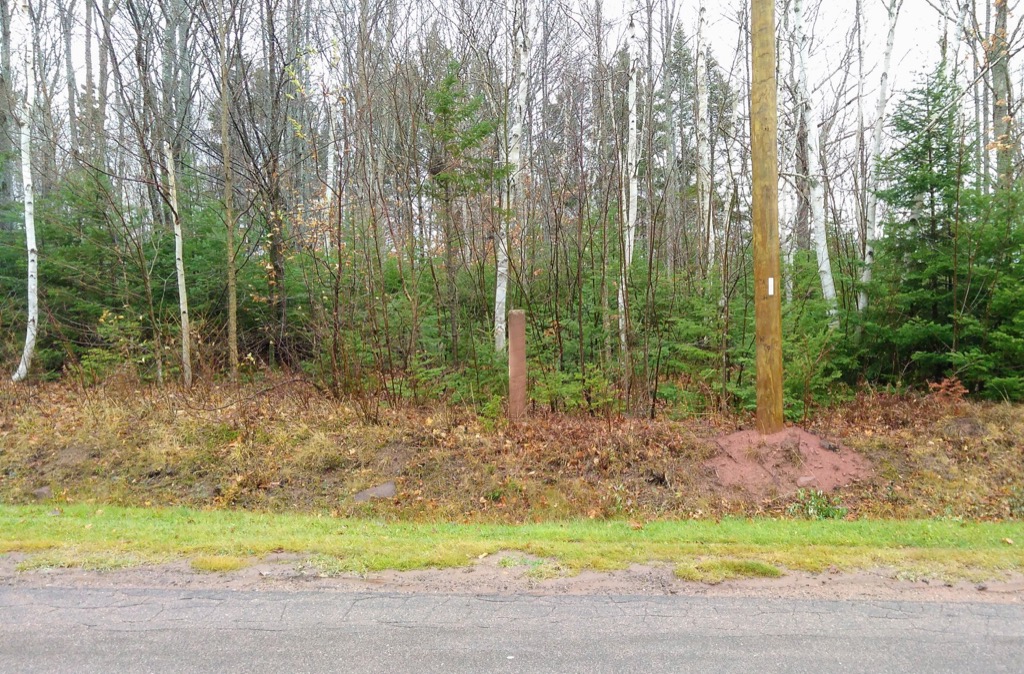 Photo of the concrete pole on the county line boundary