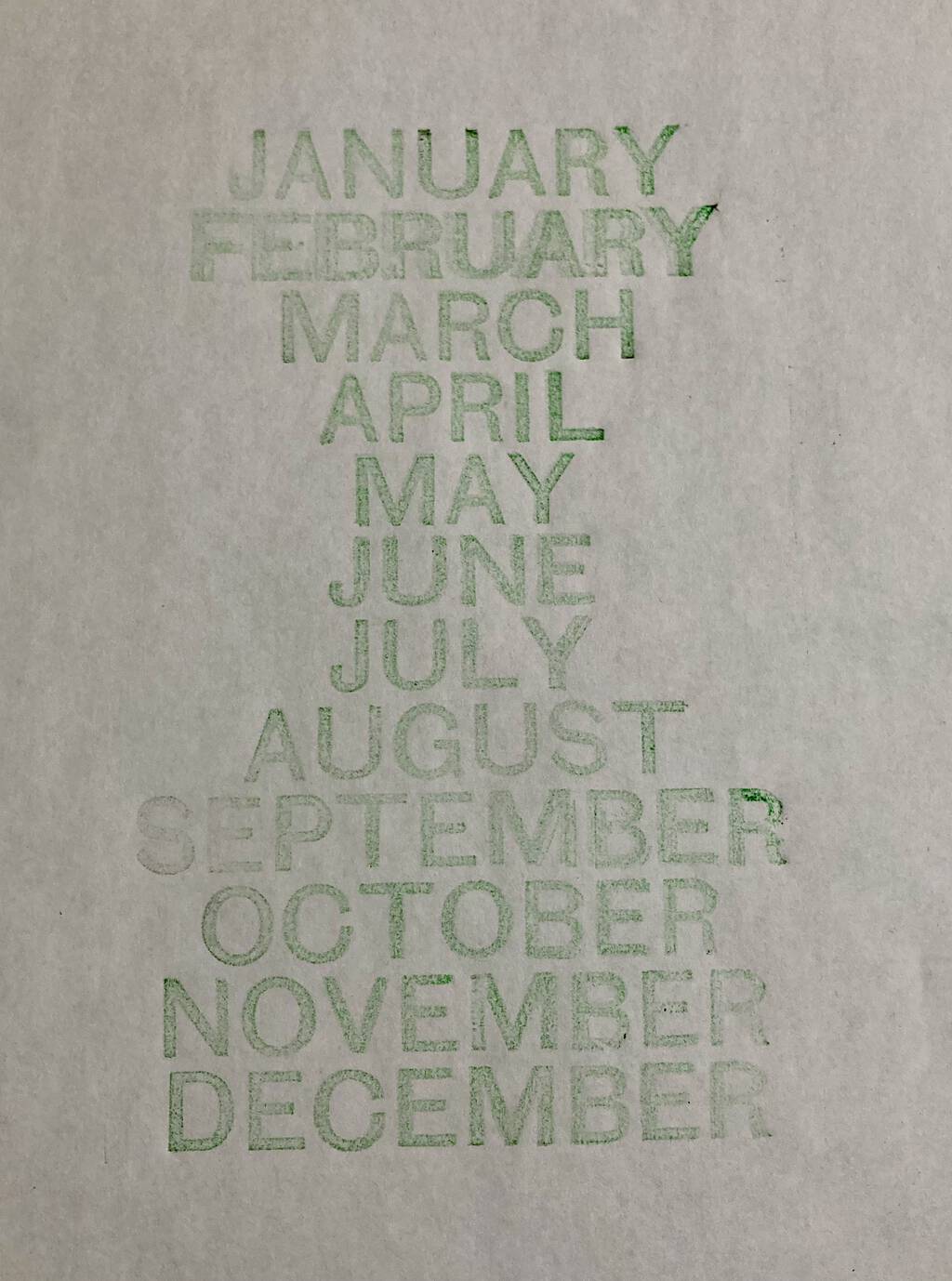 Proof of the months of the type, in green on white paper.