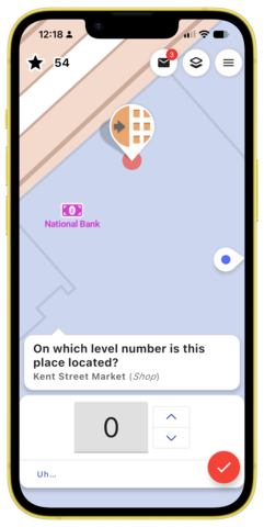 Screen shot of StreetComplete on a yellow iPhone that shows a map of Charlottetown with a prompt to update the level of a business.