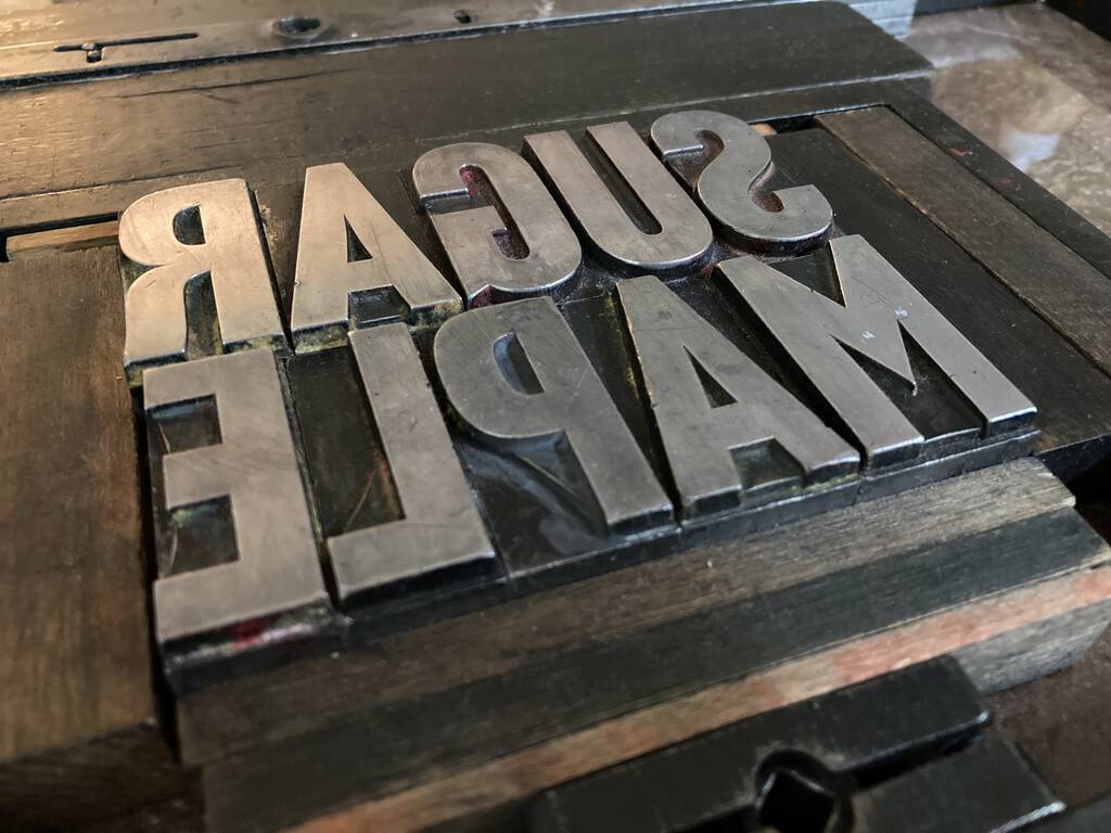 SUGAR MAPLE in metal type.