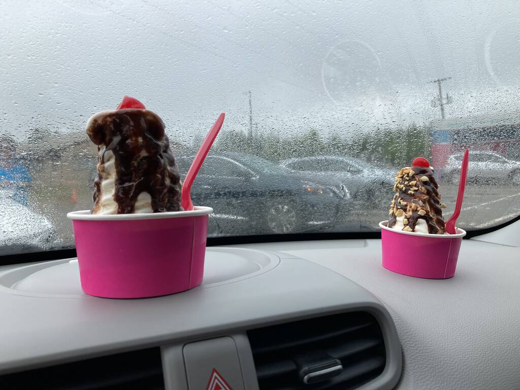 Chocolate sundaes on the dash of our car at Gillis' Drive in