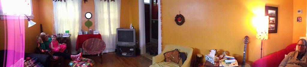 Panorama of the living room at 100 Prince, showing the TV still in the corner.