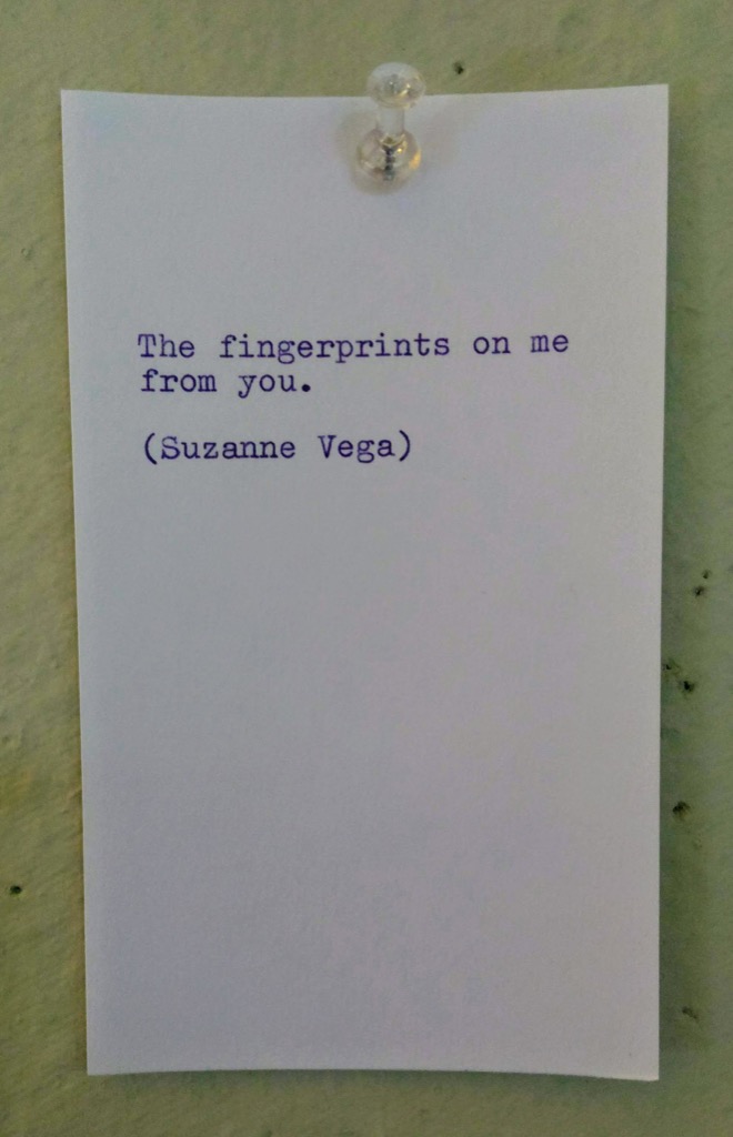 Photo of typewritten Suzanne Vega lyric snippet: Fingerprints on me from you.